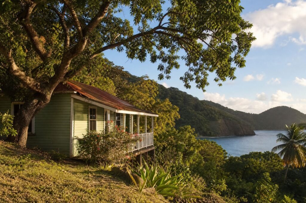 Almond Tree Cottage, a timber cottage under an almond tree on the Castara hillside