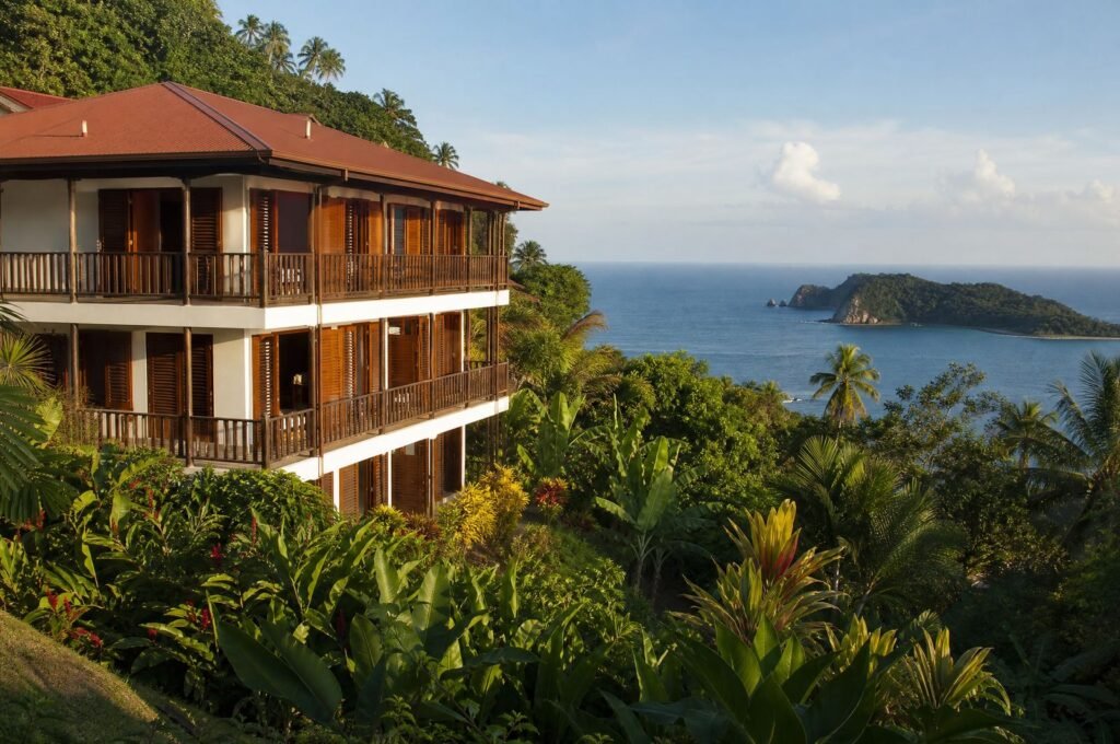 The Speyside guesthouse on the hill, with the sea and Little Tobago beyond
